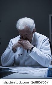 Aged Male Doctor Thinking About Medical Problem