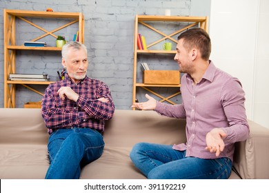 Aged Man Giving Advice To His Adult Son