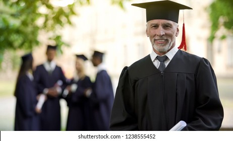 Aged Man In Graduation Outfit, Professor Obtaining New Degree, Academic Career