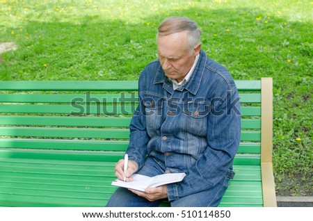 aged man making notes daily planner royalty free stock image making a daily planner