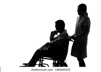Aged man sitting on a wheelchair and caregiver. Care worker concept.