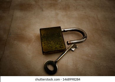 Aged metal padlock and key