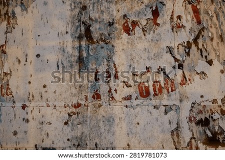 AGED PAPER BACKGROUND, GRITTY WALLAPPER PATTERN, OLD RIPPED PAPER DESIGN, CREASED PAPER TEXTURE, VINTAGE TEXTURED PAPER DESIGN AND FRAGMENTS OF TEXT, CORRODED DESIGN BACKGROUND