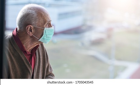 aged pensioner man with gray hair wearing medical facemask looking through window health care concept - Powered by Shutterstock