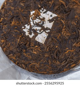 Aged Puerh Tea Cake that boasts deep, rich aromas and complex flavors you will love - Powered by Shutterstock