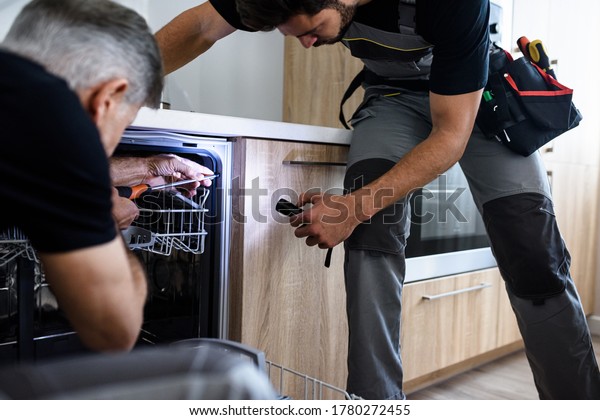 2 158 Dishwasher Repair Images Stock Photos Vectors Shutterstock   Aged Repairman Fixing Dishwasher Kitchen 600w 1780272455 