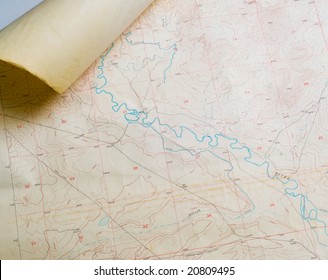 Aged Topographical Map With Rolled Corner