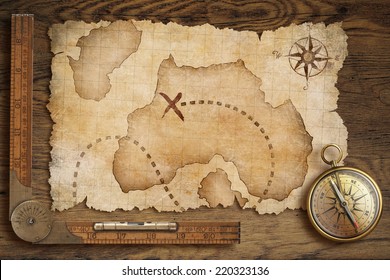 Aged Treasure Map, Ruler And Old Bronze Compass On Wooden Table Top View