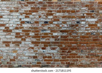 Aged Wall Texture Of Brick Building Close Up. Grunge Background With Red And White Blocks.