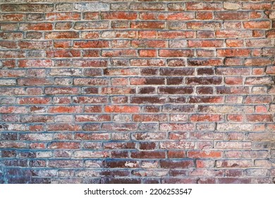 Aged Wall Texture Of Brick Building Close Up. Grunge Background With Red And White Blocks.