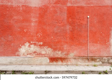 Aged weathered red street wall background