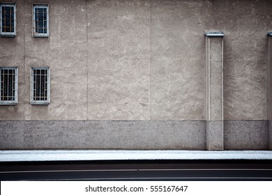 Aged weathered street wall with some windows - Powered by Shutterstock