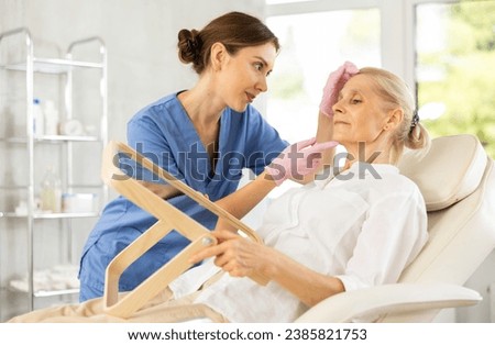 Similar – Caregiver auscultating senior woman