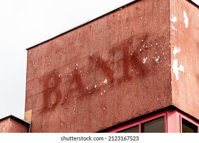 Aged and worn vintage photo of bank sign