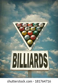 aged and worn vintage photo of billiards sign with pool balls                              