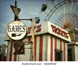 Aged And Worn Vintage Photo Of  Carnival Games Sign With Ferris Wheel                            