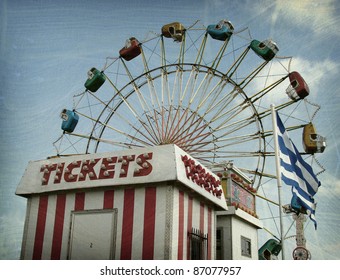 aged and worn vintage photo of carnival ride and ticket booth