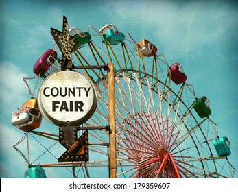 Aged And Worn Vintage Photo Of County Fair Sign With Ferris Wheel                               