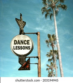 Aged And Worn Vintage Photo Of Dance Lesson Sign And Palm Trees