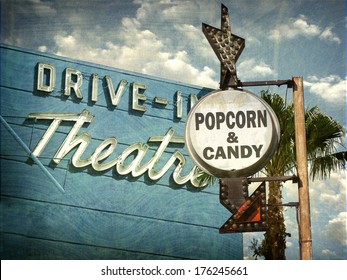 Aged And Worn Vintage Photo Of Drive In Movies Sign With Popcorn And Candy Advertisement                             