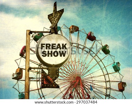  aged and worn vintage photo of freak show sign at carnival                            