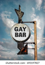 Aged And Worn Vintage Photo Of Gay Bar Sign With Arrow                               