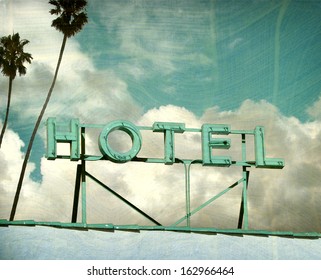  Aged And Worn Vintage Photo Of Hotel Sign And Palm Trees                              