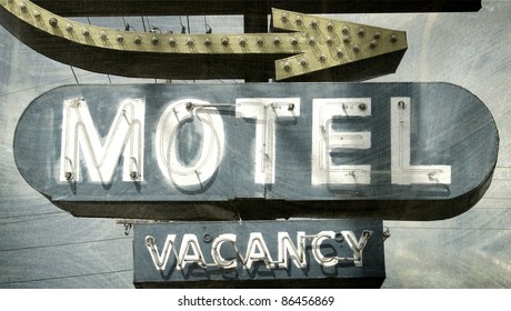   Aged And Worn Vintage Photo Of Motel Sign With Arrow