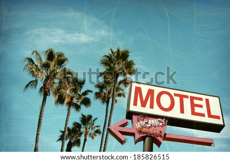  aged and worn vintage photo of motel sign palm trees                              