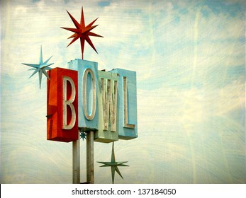   aged and worn vintage photo of neon bowl sign