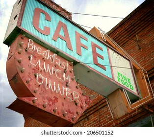 aged and worn vintage photo of old neon cafe sign