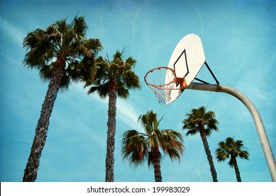  Aged And Worn Vintage Photo Of Outdoor Basketball Hoop At Beach With Palm Trees                              