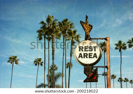 aged and worn vintage photo of rest area sign