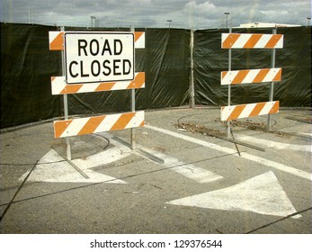 aged and worn vintage photo of  road closed barricades