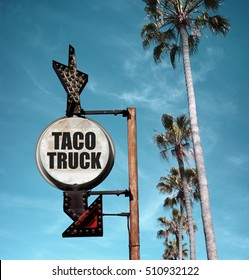 Aged And Worn Vintage Photo Of Taco Truck Sign With Palm Trees