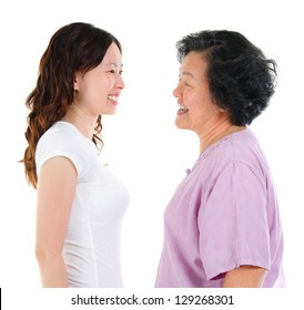 Ageing Concept. Asian Senior Mother And Adult Daughter Face To Face, Profile Side View Smiling Isolated On White Background.