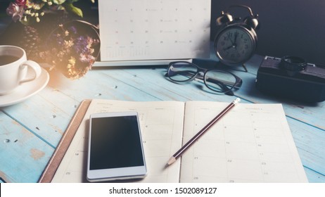 Agenda Book And Mobile Phone For Planner To Plan Timetable Appointment Organization Management Each Date Month And Year, Working Online At Home. Agenda And  2021 Calendar Concept.