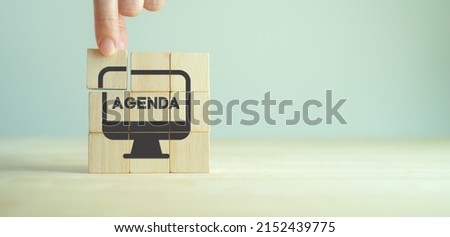 Agenda meeting appointment activity information concept. List of meeting activities in the order to be taken up, beginning with the call to order, ending with adjournment. Agenda word on wooden cubes.