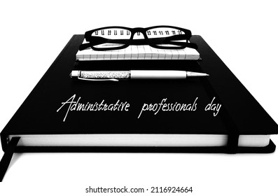 Agenda, notebook, pen and glasses isolated on white background, administrative professionals day.