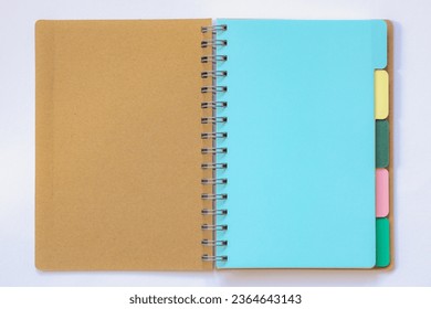 Agenda and organizer concept, Opened blank bookmark or post it in multi colored layer, Empty notebook with lines for your diary or short note, Free copy space for your text on white background.