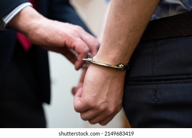 Agent Arresting A Businessman In His Office