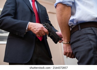 Agent Arresting A Businessman In His Office