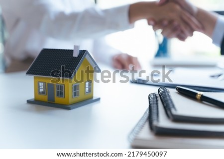 Agent and client shaking hands after signed document and done business deal for transfer right of property. house rental concept.