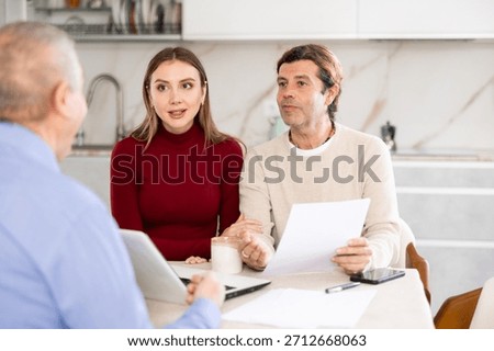 Agent explaining, suggesting and making offer to couple