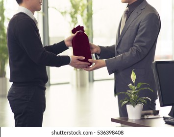 Agent Giving Customer A Premium Gift 