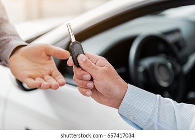 Agent Hand Giving Car Key To Client