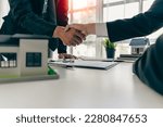 agent, lease, successful management
Real estate brokerage manager shaking hands with client after signing home purchase contract in real estate agency office