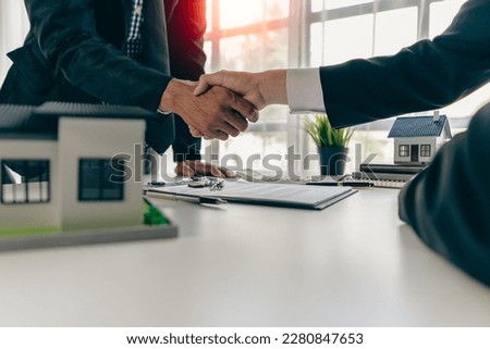 agent, lease, successful management
Real estate brokerage manager shaking hands with client after signing home purchase contract in real estate agency office Сток-фото © 