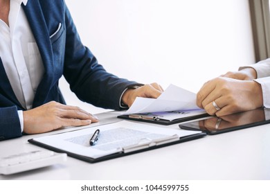 Agent man presentation and consulting car insurance detail to customer and waiting for his reply to finish.