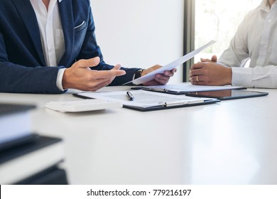 Agent man presentation and consulting car insurance detail to customer and waiting for his reply to finish. - Shutterstock ID 779216197
